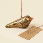 black and gold leaf hanging bird